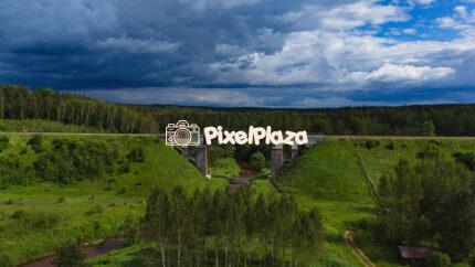 Railway Bridge Over the Rauna River - Aerial View of Latvian Countryside